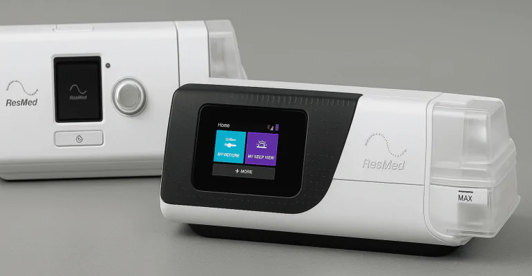 Side-by-side image of ResMed AirSense 11 and AirSense 10 CPAP machines, showing modern and older designs for a power efficiency comparison.