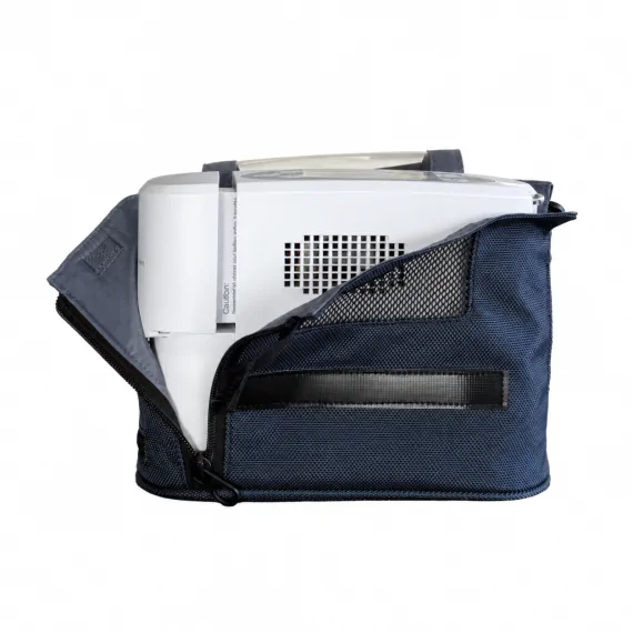 Oxymed portable concentrator in its sling carry bag - side view
